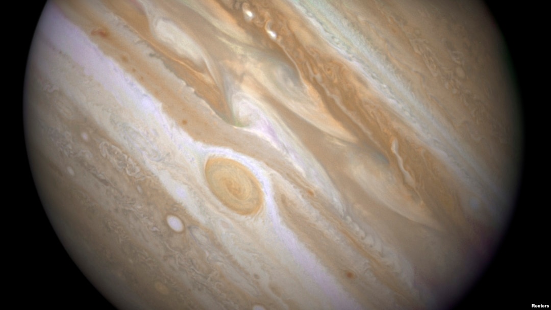 FILE - The planet Jupiter is shown with one of its moons, Ganymede (bottom), in this NASA handout taken April 9, 2007, and obtained by Reuters, March 12, 2015.