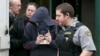 FILE - Jeffrey Delisle leaves court following his sentencing at the provincial court in Halifax, Nova Scotia, Feb. 8, 2013. 