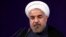 FILE - Iranian President Hasan Rouhani speaks at his first press conference since taking office. Aug. 6, 2013. 