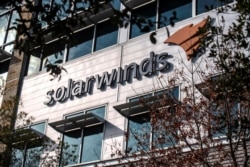 The SolarWinds logo is seen outside its headquarters in Austin, Texas, Dec. 18, 2020.