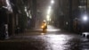 Petugas pemadam kebakaran berpatroli di jalan yang dilanda hujan deras dari Topan Hagibis di bangsal Ota di Tokyo, Jepang, 12 Oktober 2019. Foto ini diambil oleh Kyodo. (Foto: Reuters)