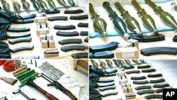 The Syrian official news agency SANA shows weapons that were found in the province of Homs, Syria, September 27, 2011.