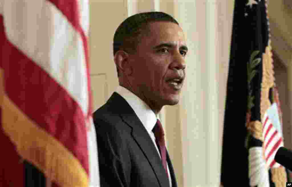 President Barack Obama reads his statement to photographers after making a televised statement on the death of Osama bin Laden from the East Room of the White House in Washington, Sunday, May 1, 2011. (AP Photo/Pablo Martinez Monsivais)