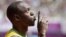 Jamaica's Usain Bolt gestures before competing in a men's 100-meter heat in London, August 4, 2012.