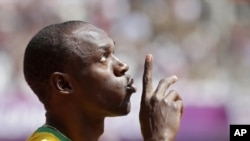 Jamaica's Usain Bolt gestures before competing in a men's 100-meter heat in London, August 4, 2012.