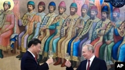 中国国家主席习近平2023年3月21日在莫斯科会见俄罗斯总统普京。（美联社）
