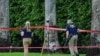 Members of the FBI investigate the area around Trump International Golf Club in West Palm Beach