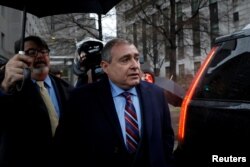 FILE - Lev Parnas, associate of President Donald Trump's personal lawyer Rudy Giuliani, exits after a bail hearing at the Manhattan Federal Court in New York, Dec. 17, 2019.