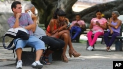 People use the internet at a public Wi-Fi zone in Havana, Cuba, June 4, 2018. 