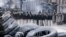 Police stand at the site of clashes with anti-government protesters in Kyiv, Jan. 24, 2014. 