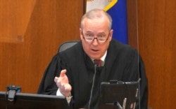 Hennepin County Judge Peter Cahill discusses motions before the court, April 15, 2021, in the trial of former Minneapolis police officer Derek Chauvin, at the Hennepin County Courthouse in Minneapolis.