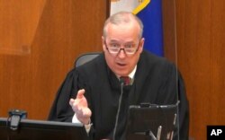 Hennepin County Judge Peter Cahill discusses motions before the court, April 15, 2021, in the trial of former Minneapolis police officer Derek Chauvin, at the Hennepin County Courthouse in Minneapolis.