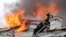 Firefighters work to extinguish a fire at a local clinic of cardiac surgery in the city of Blagoveshchensk, Russia.