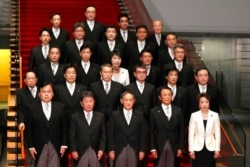 FILE - Japan Prime Minister Yoshihide Suga, front center, and his cabinet, with two women, are shown at his residence in Tokyo, Sept. 16, 2020. Women account for less than 10% of lawmakers in the more powerful of Japan's two-chamber parliament.