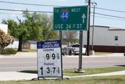 Gas prices are posted as .999 for regular and 1.37 for premium at a Sam's Club, April 21, 2020, in Oklahoma City, as oil prices continue to drop.