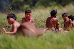FILE - Indigenous people from Yanomami ethnic group are seen, amid the spread of the coronavirus disease, at the 4th Surucucu Special Frontier Platoon of the Brazilian army in municipality of Alto Alegre, state of Roraima, Brazil, July 1, 2020