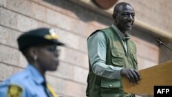 FILE - Kenyan President William Ruto (R) speaks at the opening of the third session of the Intergovernmental Negotiating Committee to develop an international legally binding instrument on plastic pollution at the United Nations Office, in Nairobi on November 13, 2023