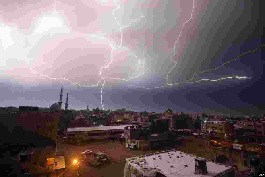 Lightning strikes over Rafah in the southern Gaza Strip during heavy rains.