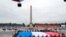 Members of medical staff pose with the French flag as they take part in the annual Bastille Day military ceremony on the Place de la Concorde in Paris, July 14, 2020.