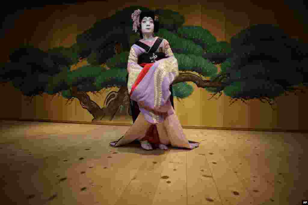 Kabuki actor Kyozo Nakamura performs female role of &quot;Fuji-musume,&quot; The Wisteria Maiden, during a demonstration at Kabuki Gallery in Tokyo. 