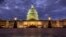 Lights shine inside the U.S. Capitol Building as night falls in Washington, Jan. 21, 2018. 