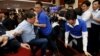 Ruling Democratic Progressive Party (DPP) legislator Chao Tien-lin, left, scuffles with opposition Kuomintang (KMT) legislators during budget meeting for the infrastructure development program, at the Legislative Yuan in Taipei, Taiwan, July 18, 2017.