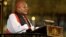 FILE - Archbishop Desmond Tutu speaks during a memorial service for former South African President Nelson Mandela at Westminster Abbey in London, March 3, 2014. (John Stillwell/Pool/Reuters)