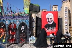 FILE - People visit the tomb of Iran's senior military commander General Qassem Soleimani on January 2, 2021 in his hometown of Kerman to mark the one year anniversary of his being killed in a US attack.  (Credit: WANA)