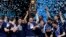 Villanova players celebrate with the trophy after beating Michigan 79-62 in the championship game of the Final Four NCAA college basketball tournament, Monday, April 2, 2018, in San Antonio. 