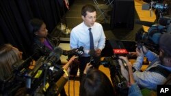 Democratic presidential candidate Pete Buttigieg speaks to the media following a panel discussion at a campaign stop, in Nashua, New Hampshire, Oct. 24, 2019.