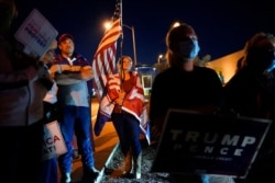 FILE - Supporters of President Donald Trump protest the Nevada vote in front of the Clark County Election Department in Las Vegas, Nov. 4, 2020.