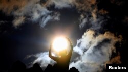 A person celebrates the summer solstice at the Kokino megalithic observatory, near the city of Kumanovo, North Macedonia.
