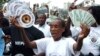 FILE - Kenyan demonstrators take to the streets with calls for increased funding to ensure universal access to HIV/AIDS treatment, in Nairobi. 