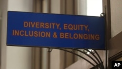 FILE - The sign above the door to the Office of Diversity, Equity, Inclusion and Belonging inside the main administration building on the main University of Kansas campus is seen on April 12, 2024, in Lawrence, Kansas.