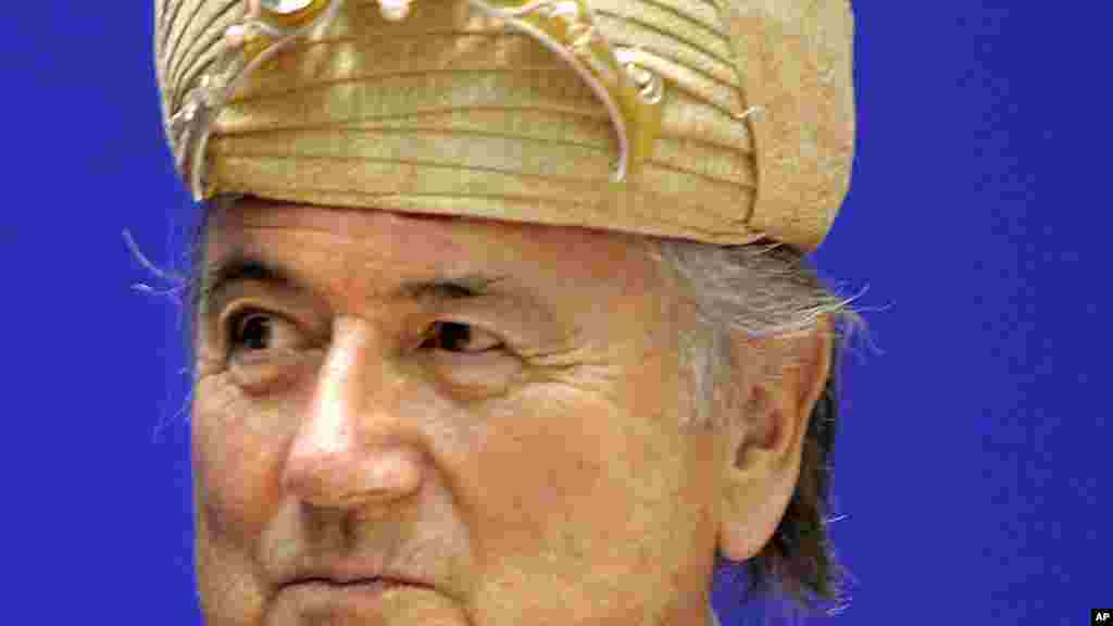 FIFA President Sepp Blatter looks on after being presented with an Indian traditional hat at the 70th Anniversary of Indian Football, in New Delhi, April 17, 2007.