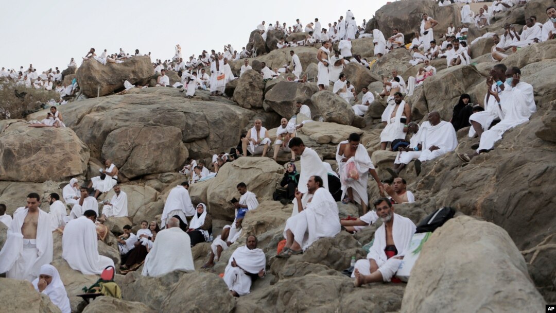 Muslim pilgrims gather to pray at Jabal Al Rahma holy mountain, or the mountain of forgiveness, during the annual pilgrimage, known as the hajj, near Mecca, Saudi Arabia, Oct. 3, 2014. 
