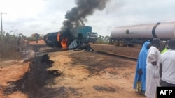 This video grab from footage provided by the Niger State Emergency Management Agency (NEMA) shows flames and smoke billowing from a fuel tanker that exploded in Niger state's Agaie local government district, Sept. 8, 2024.