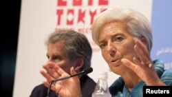 International Monetary Fund (IMF) Managing Director Christine Lagarde (R) and IMF First Deputy Managing Director David Lipton hold a news conference at the annual meetings of the International Monetary Fund and the World Bank Group in Tokyo October 11, 20