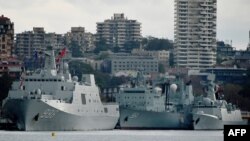 Three Chinese warships are seen docked at Garden Island naval base in Sydney, Austalia, June 3, 2019. Australians were surprised by the sight of three Chinese warships steaming into to Sydney Harbour, forcing the prime minister to reassure jittery residents. 