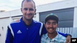 FILE - In this October 2018 photo, John Allen Chau, right, with the Founder of Ubuntu Football Academy Casey Prince, in Cape Town, South Africa, days before he left for in a remote Indian island of North Sentinel Island.