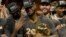 Cleveland Cavaliers forward LeBron James, center, celebrates with teammates after Game 7 of basketball's NBA Finals against the Golden State Warriors in Oakland, Calif., Sunday, June 19, 2016.