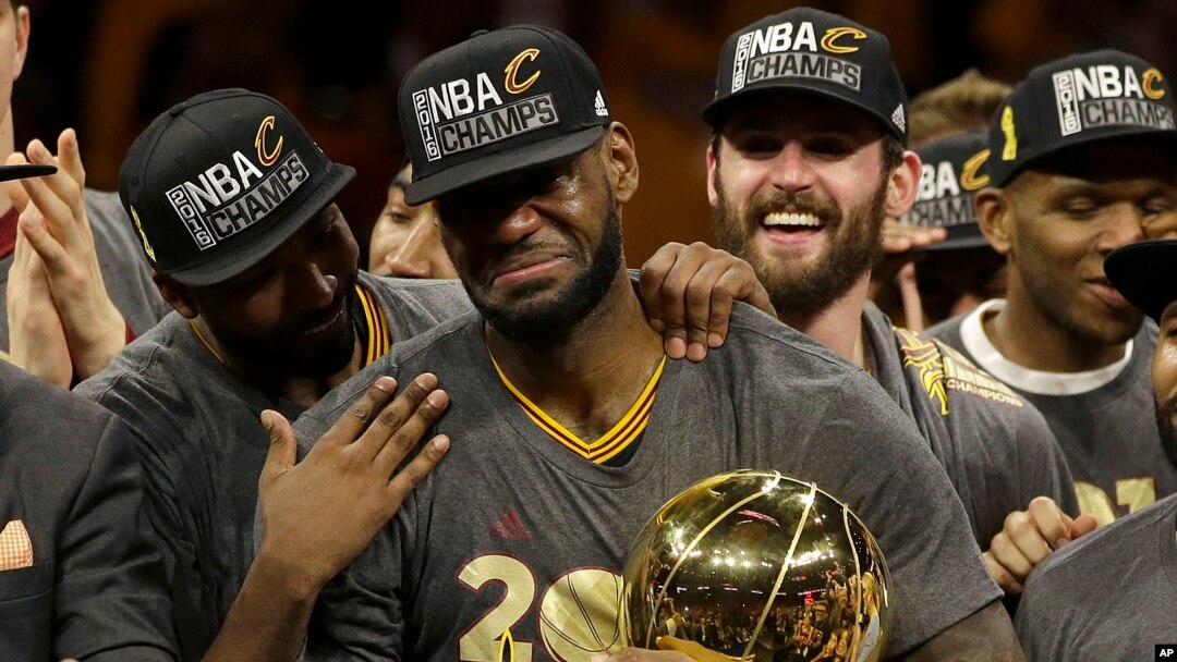 Cleveland Cavaliers forward LeBron James, center, celebrates with teammates after Game 7 of basketball's NBA Finals against the Golden State Warriors in Oakland, Calif., Sunday, June 19, 2016.