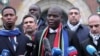 FILE - South Africa's Minister of Justice and Correctional Services Ronald Lamola, center, and Palestinian assistant Minister of Multilateral Affairs Ammar Hijazi, right, address the media outside the ICJ in The Hague, Jan. 11, 2024. 