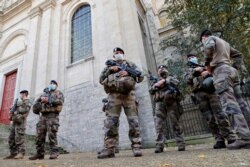 French soldiers, part of France's national security alert system "Sentinelle", patrol near the Cathedral in Arras as France has raised the security alert for French territory to the highest level after the knife attack in the city of Nice, France.