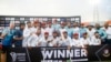 Afghanistan's cricket team members pose for photo after winning test against Bangladesh