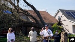 US President Joe Biden speaks as he tours a neighborhood impacted by Hurricane Ida, Sept. 3, 2021, in LaPlace, La.