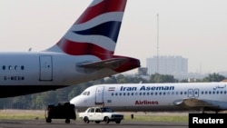 An Iranian Aseman Airlines Fokker prepares to take off at Tehran's Mehrabad airport, Aug. 6, 2007. An Aseman Airlines ATR-72 crashed Sunday in southern Iran, killing all 66 aboard, state media reported.