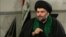 Shi'ite cleric Moqtada al-Sadr speaks with the Alhurra television network. 