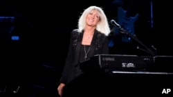 FILE - Christine McVie from the band Fleetwood Mac performs at Madison Square Garden in New York on Oct. 6, 2014. McVie, the soulful British musician who sang lead on many of Fleetwood Mac’s biggest hits, has died at 79. (Photo by Charles Sykes/Invision/AP, File)