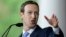 Facebook CEO and Harvard dropout Mark Zuckerberg delivers the commencement address at Harvard University, May 25, 2017, in Cambridge, Mass. On Tuesday, Zuckerberg praised Lola Omolola Tuesday for her Female IN Facebook page.